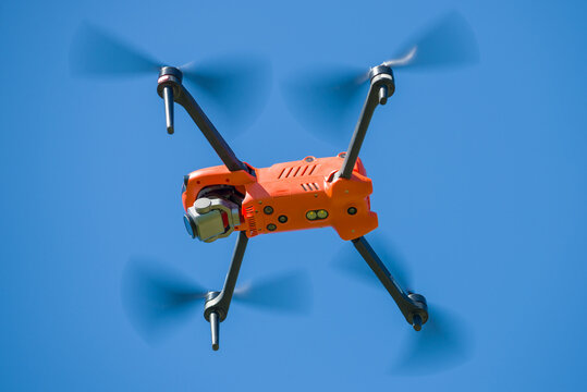 LENINGRAD REGION, RUSSIA - MAY 30, 2021: Quadcopter Autel Robotics EVO II in flight. Bottom view
