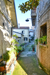 Fototapeta na wymiar A small street between the old houses of Savoia di Lucania, a small town in the province of Potenza in Basilicata, Italy. 