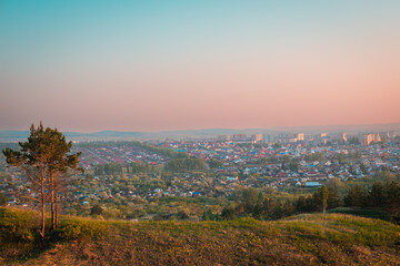 City, view from the mountain. Beautiful summer sunset.