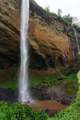 Fototapeta na wymiar Very high waterfall, one of the Sipi Falls in Mount Elgon National Park