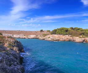 The nice small beach of Porto Badisco in Apulia (Italy), nestled amid the cliffs and the yellow...