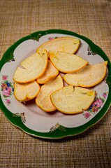 Orange peel on a plate for making fruit tea, alcohol tincture and for medical purposes