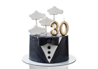 Conceptual cake in the form of a tuxedo suit for an anniversary and a cloud for an inscription. Close up on white background