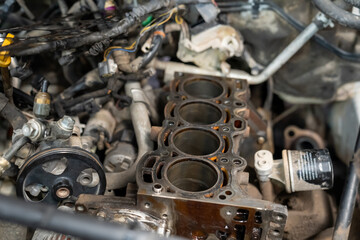 Fototapeta na wymiar Checking and repairing an internal combustion engine in an auto repair shop.