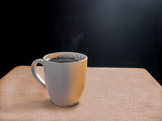 Cup of coffee on wooden table with a black background.