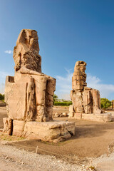 Giant stone statues of Pharaoh Amenhotep III near the Valley of the Kings, Luxor, Egypt.