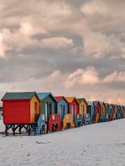 Naklejka premium beach huts at sunset