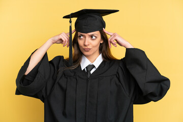 Young university graduate isolated on yellow background having doubts and thinking