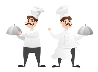 Chefs in white hat in a restaurant kitchen preparing food. Cute chefs in uniform holding an empty dish. Professional master.
