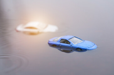 Two cars were submerged in flooding. One of them is out of focus.