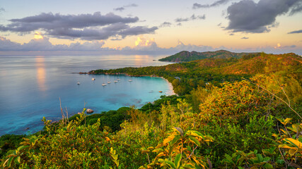 sunset at tropical beach anse lazio on praslin on the seychelles