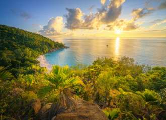 sunset at tropical beach anse georgette on praslin on the seychelles