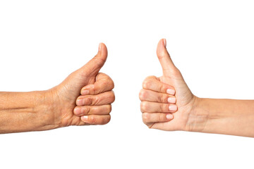 Young and old female hands show a gesture of approval. Thumbs up isolated on white background