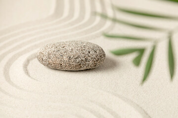 Fototapeta na wymiar Zen stones on sand. Zen garden background scene. 