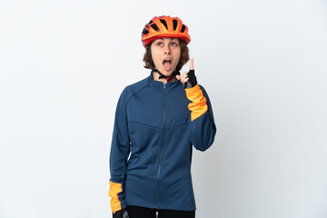 Young English cyclist woman isolated on white background thinking an idea pointing the finger up