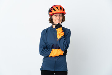 Young English cyclist woman isolated on white background having doubts and thinking