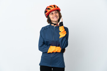 Young English cyclist woman isolated on white background pointing up a great idea