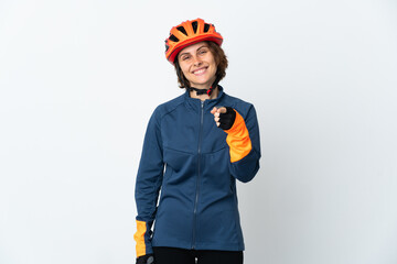 Young English cyclist woman isolated on white background pointing front with happy expression