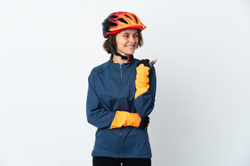 Young English cyclist woman isolated on white background pointing to the side to present a product