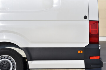 background body of white commercial van in close-up