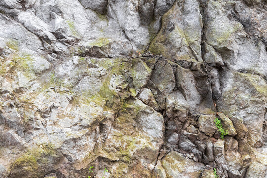 Rocky cliff texture, natural gray stone wall