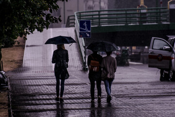 People walking in the rain
