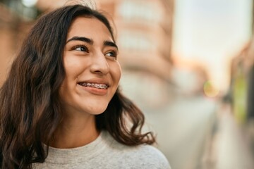 Fototapeta premium Young middle east girl smiling happy standing at the city.