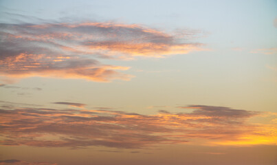 Pastel colors clouds on sunset background