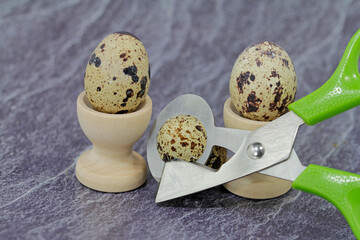Open quail eggs and eat them