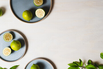 Lemons on blue plates on wood background - Flat lay photography