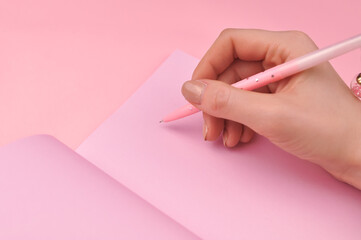 hand with pink pen