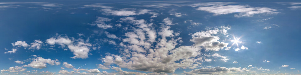 Obraz premium blue sky hdr 360 panorama with white beautiful clouds in seamless projection with zenith for use in 3d graphics or game development as sky dome or edit drone shot for sky replacement