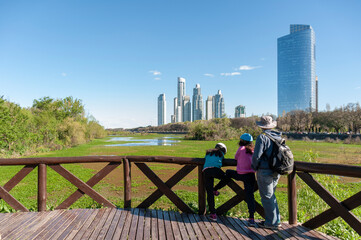 People looking towards Puerto Madero from the Costanera Sur Ecological Reserve