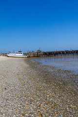 Abandoned Shipwrecked Boat Next to Dilapidated Dock