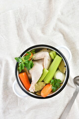 Chicken broth with vegetables and spices