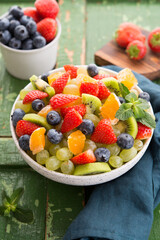 Fresh fruit salad, blueberries, strawberries, grapes, kiwi, orange.