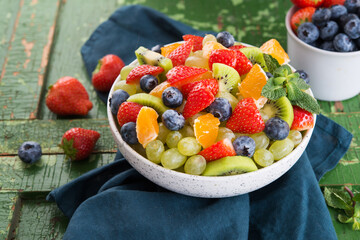 Fresh fruit salad, blueberries, strawberries, grapes, kiwi, orange.