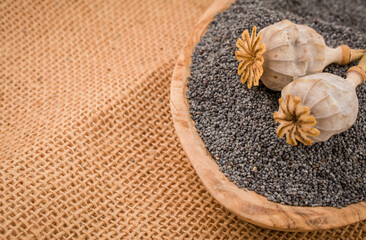 Obraz na płótnie Canvas Pile poppyseed,Poppy seeds background close up .