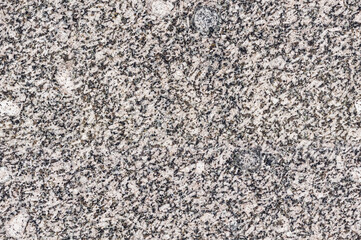 seamless mottled beige and black granite texture. stone natural surface
