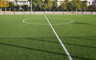 Lawn field for playing football. Close-up of soccer field with green grass