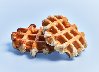  Two delicious waffles over blue background