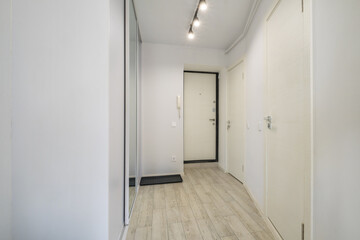 long empty corridor in interior of entrance hall of modern apartments, office or clinic