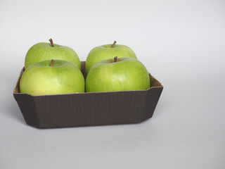 Granny Smith apple fruit food in cardboard basket
