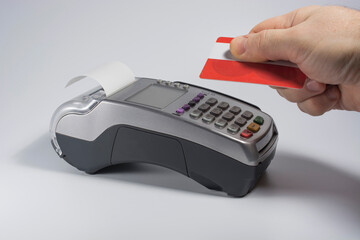 Payment for the transaction using a contactless card and NFC technology. Front view.