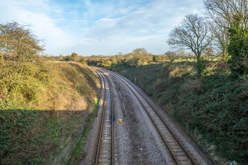 Fototapeta na wymiar Reedham, Norfolk, UK – January 2022. The Norwich to Reedham railway line captured from above standing on one of the many bridges