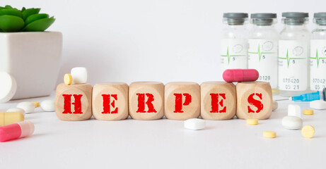 Herpes - word from wooden blocks with letters, viral diseases herpes viruses concept, blue...