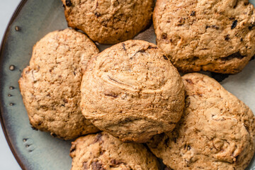 Close up on crunchy oatmeal chip cookies fresh baked biscuits with chocolate