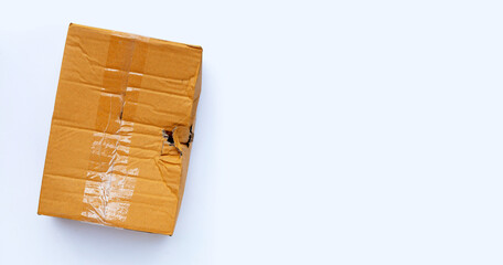 Damaged cardboard box with hole