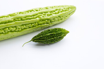 Bitter melon with bitter gourd on white background.