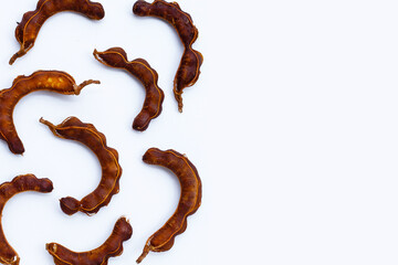 Ripe tamarind on white background.